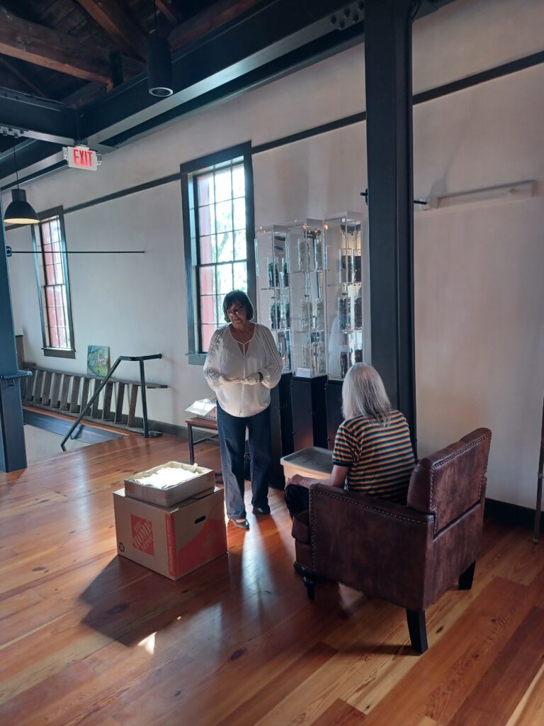 Myrna Crook and Wyck DeLong at work