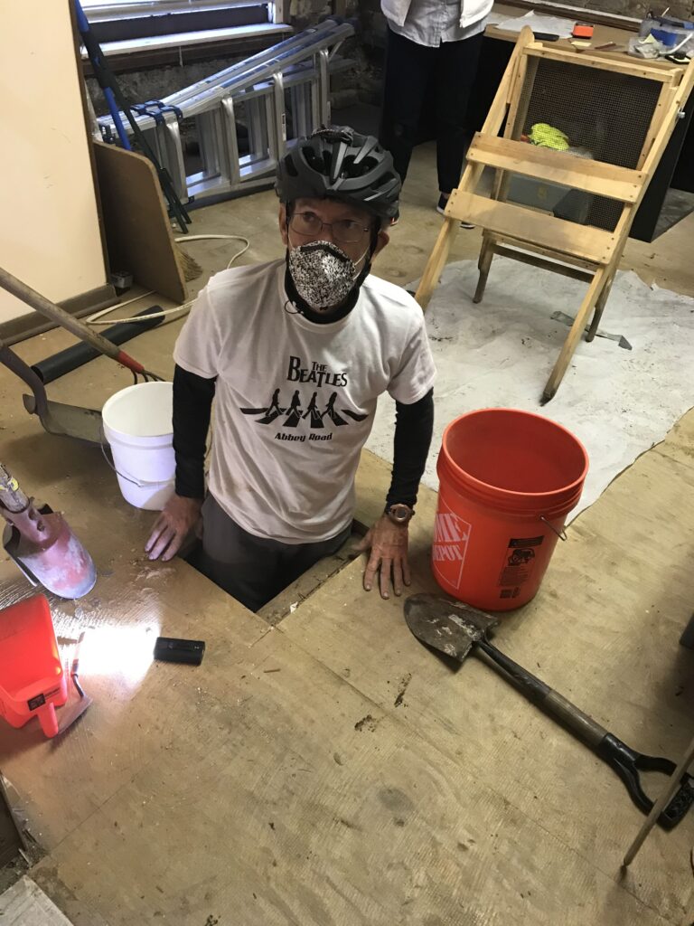 Dr. Honerkamp exploring the lower foundation of the Adam Strain Building