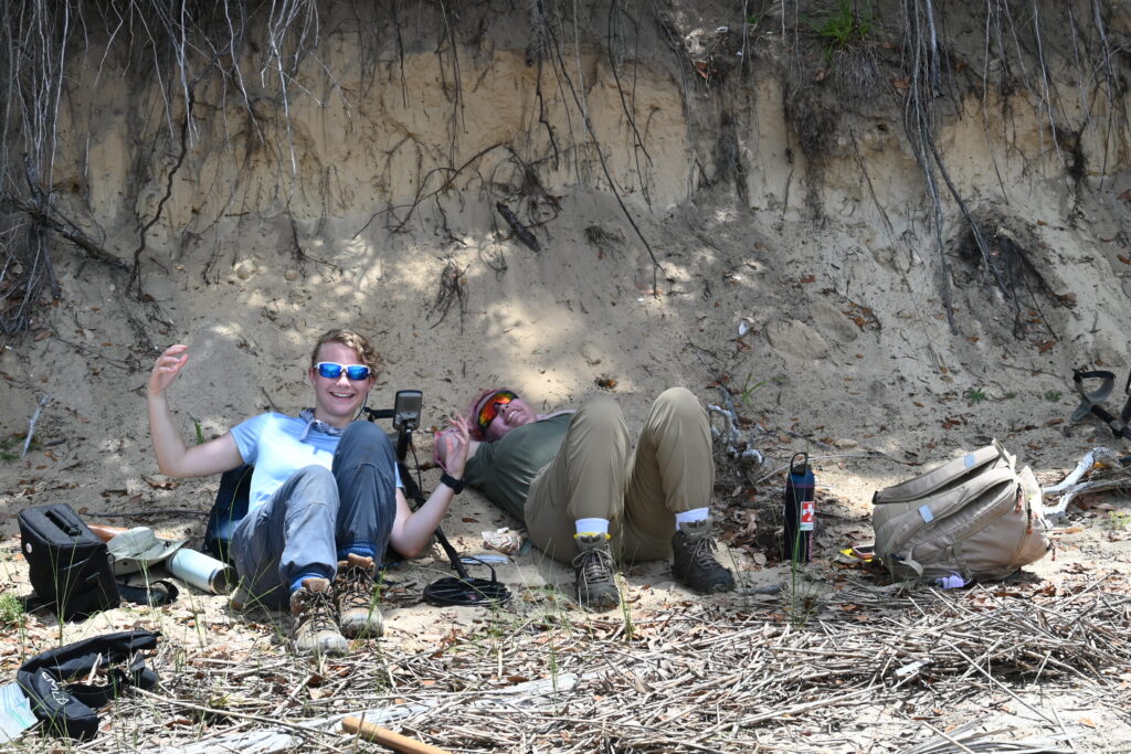 2026 ETSU field crew members taking a well-deserved break from the heat along the shoreline